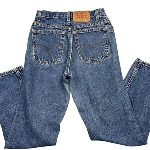 Vintage Levi’s 550 medium wash 90s jeans USA made tapered leg 26 x 29